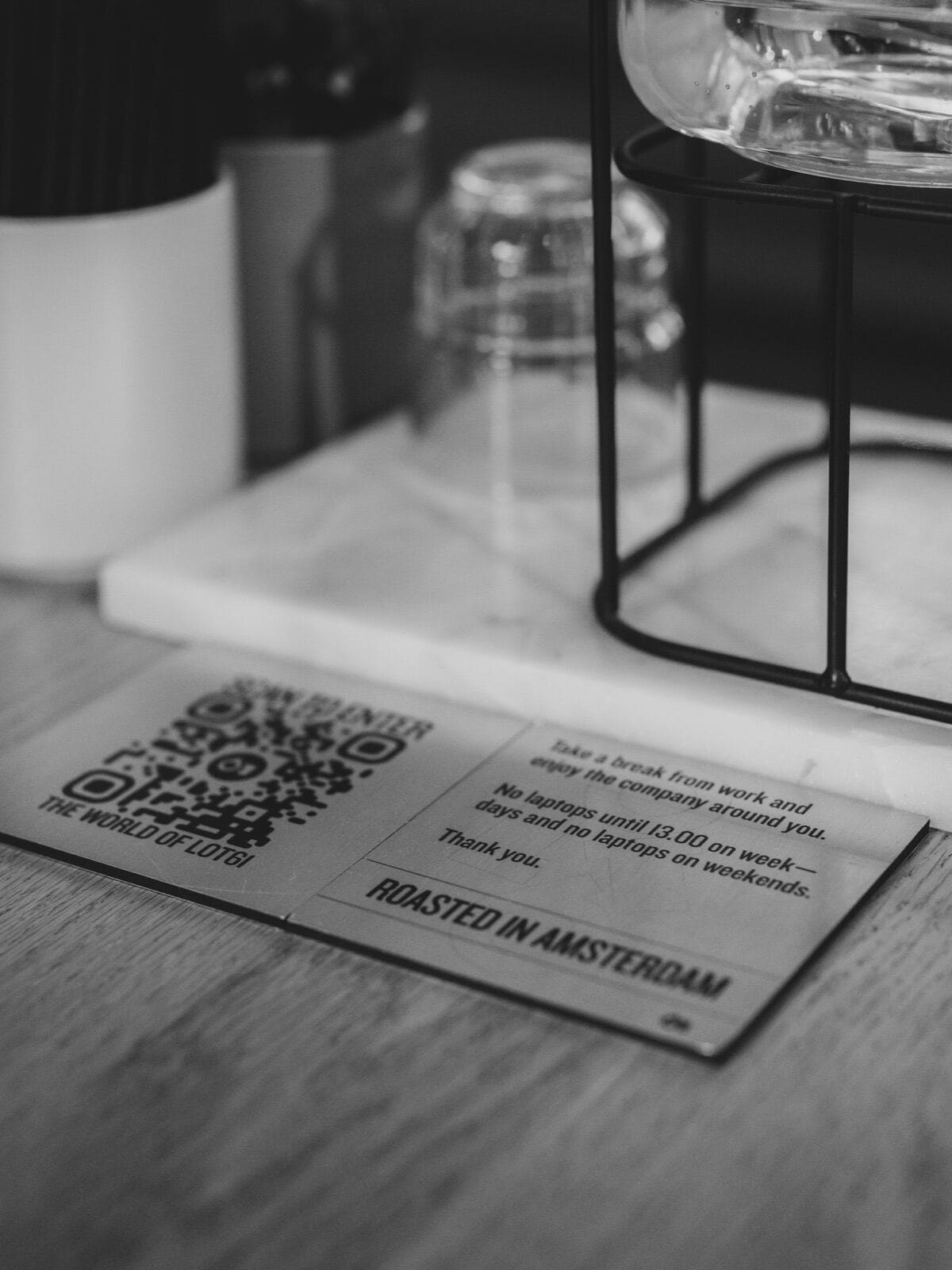 Card with a QR code standing on a cafe table